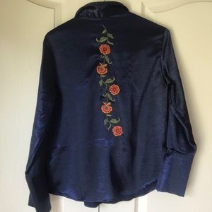 Satin embroidered blouse.
